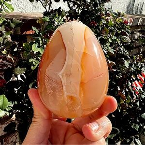 Orangey Pink Carnelian Egg With Quartz Carving